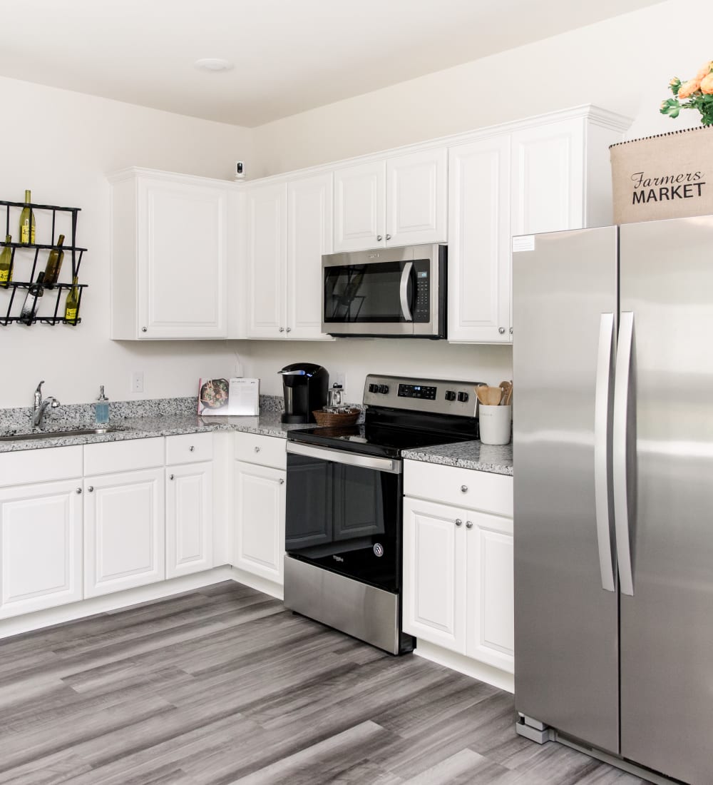 Spacious kitchen with stainless-steel appliances at Artisan Living Bella Citta in Davenport, Florida