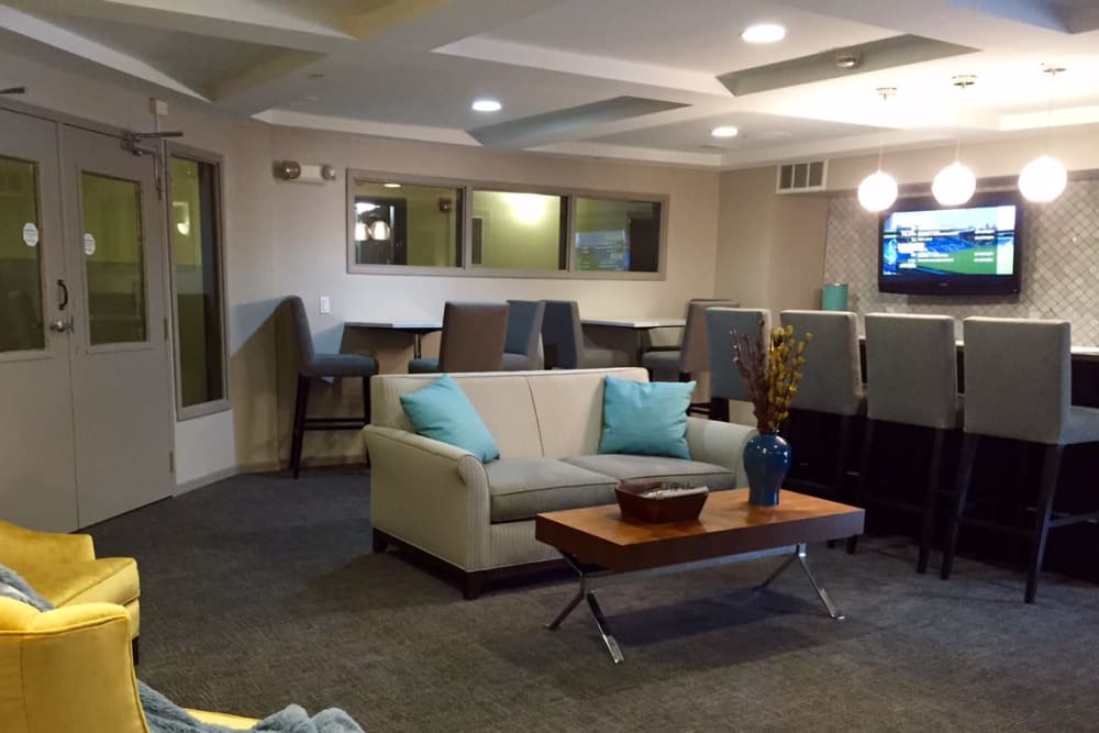 A comfortable clubhouse lounge with bar seating at Loring Park Apartments in Minneapolis, Minnesota