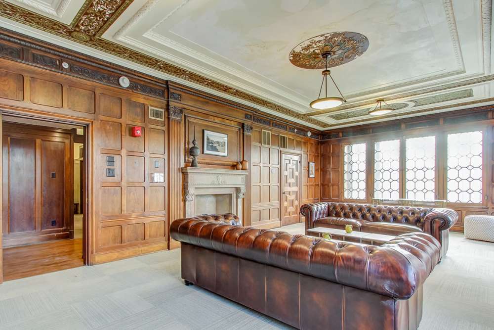 Elegant lounge with leather sofas at 43 Town Square in Lima, Ohio
