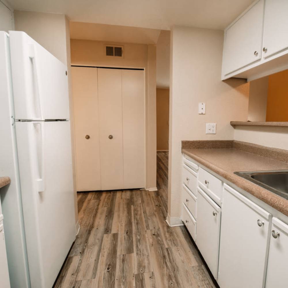 Kitchen with White cabinet and refrigerator at Windsor Ridge in Sacramento, California