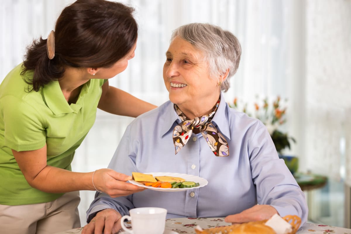 A woman enjoying a meal at Broadwell Senior Living in Plymouth, Minnesota