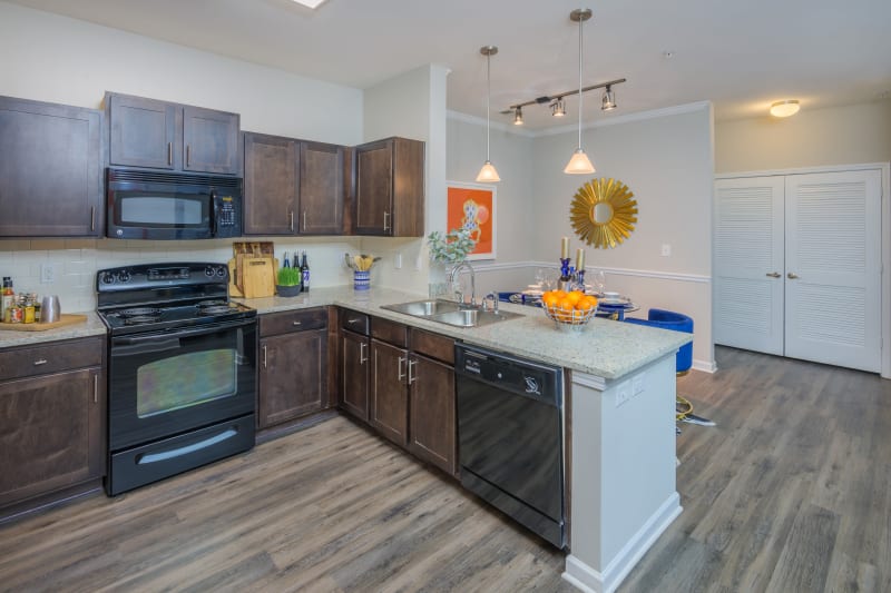Kitchen with hardwood flooring at Sterling Town Center in Raleigh, North Carolina