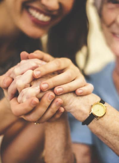 Women holding hands at The Phoenix at Lady's Island in Beaufort, South Carolina