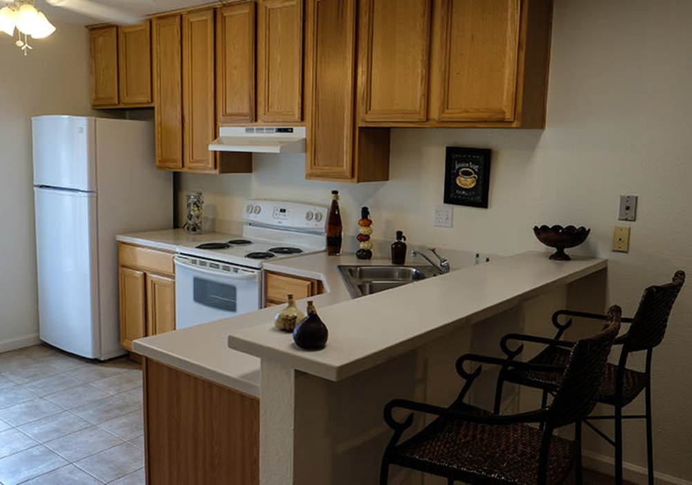 Kitchen with breakfast bar at The Hills in San Diego, California