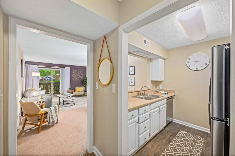 Kitchen connecting to living room at The Ellery of Cary in Cary, North Carolina