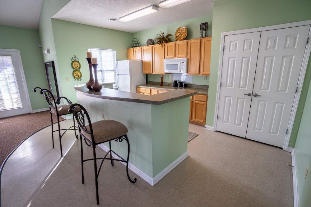 Community kitchen with barstool at Eagles Landing in Memphis, Tennessee