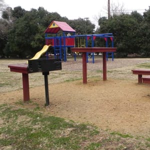 Resident playground and grilling area at Bent Creek Apartments in Lewisville, Texas