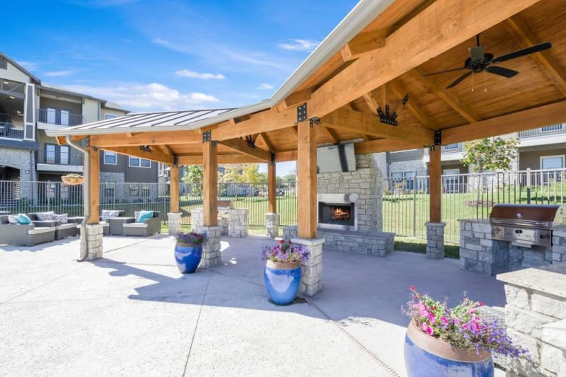 Outdoor fireplace and BBQ ready to grill up some burgers at Verandas at Alamo Ranch in San Antonio, Texas