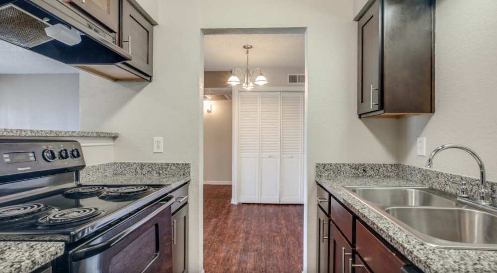 Kitchen with stainless-steel appliances at Creekstone in Dallas, Texas