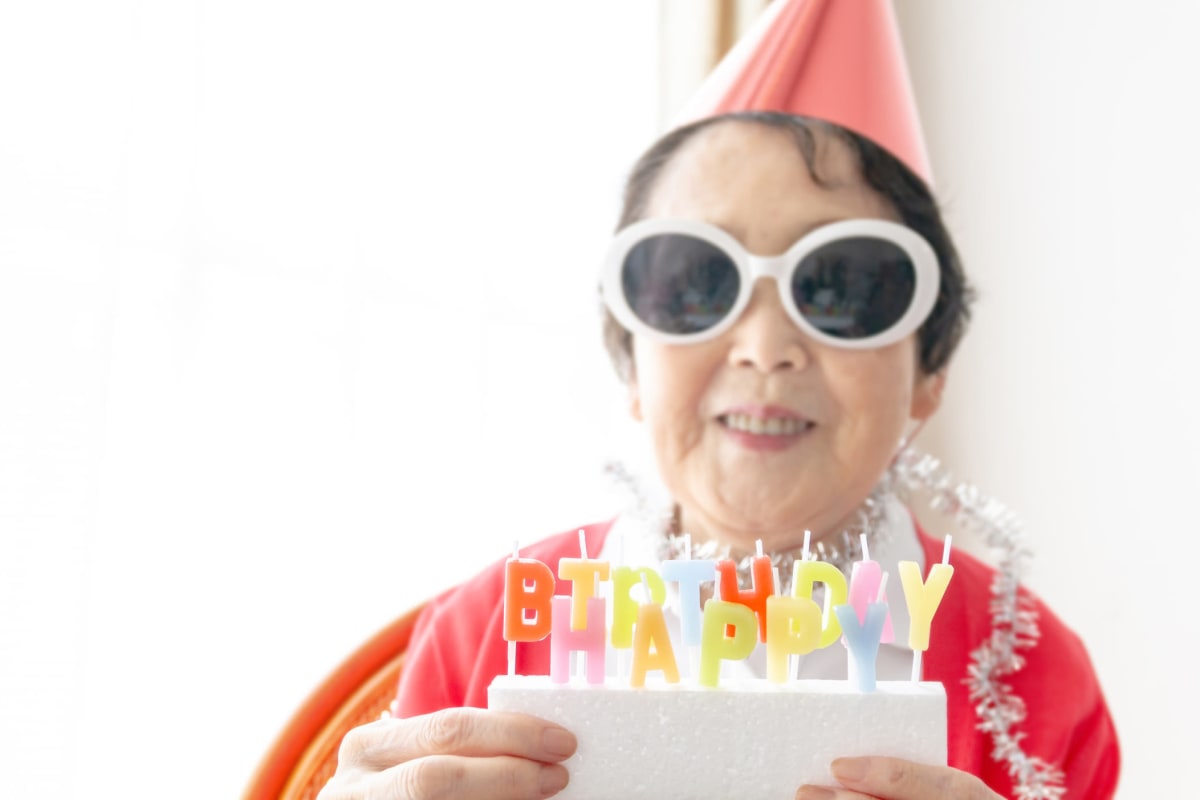 Resident celebrating a birthday at Saddlebrook Oxford Memory Care in Frisco, Texas