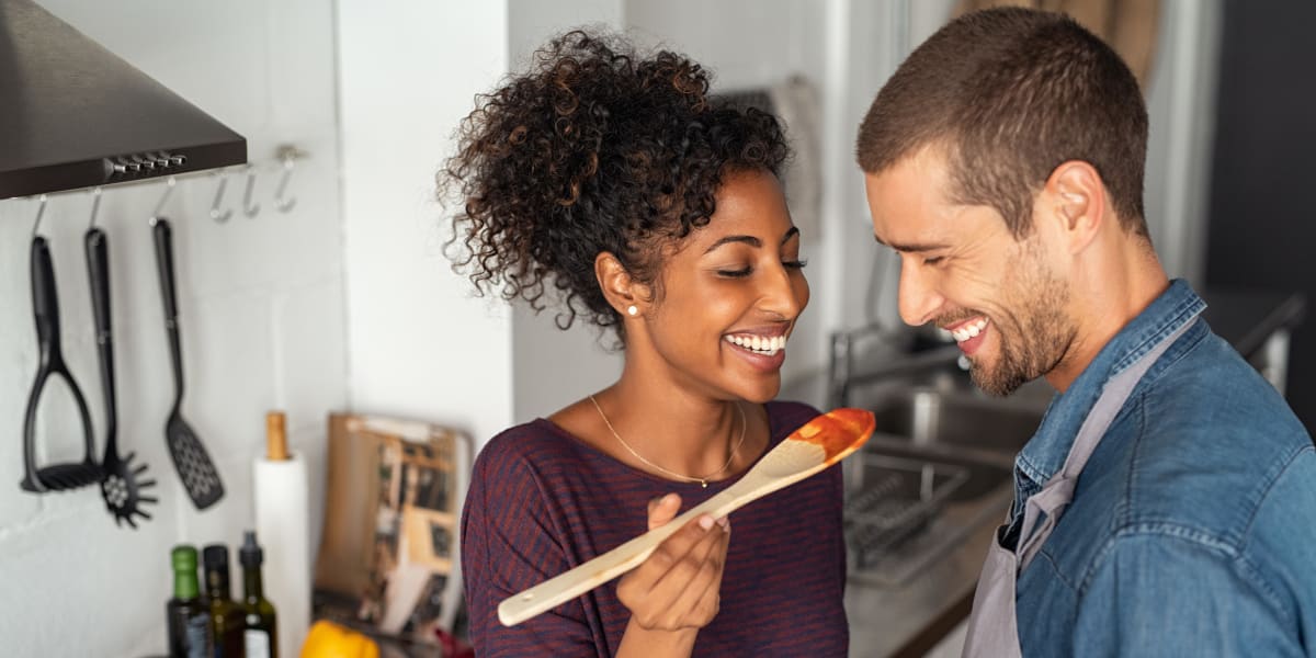 Resident couple test tasting their cooking at Marquis at Katy in Katy, Texas