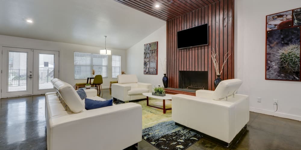 Fireplace and comfortable seating in the clubhouse at The Sage at 1955 in San Antonio, Texas