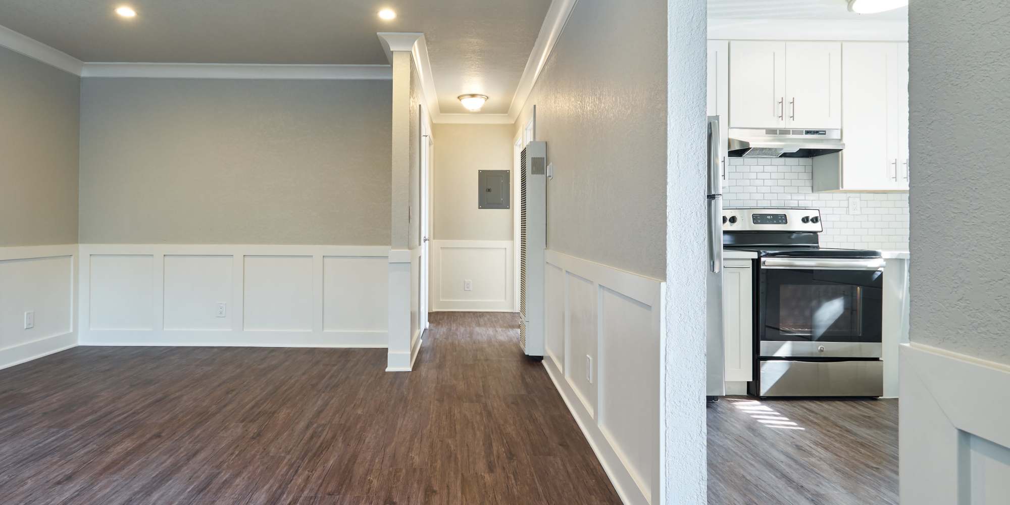 spacious living room with kitchen view at 24th Ave Apartments in Santa Cruz, California