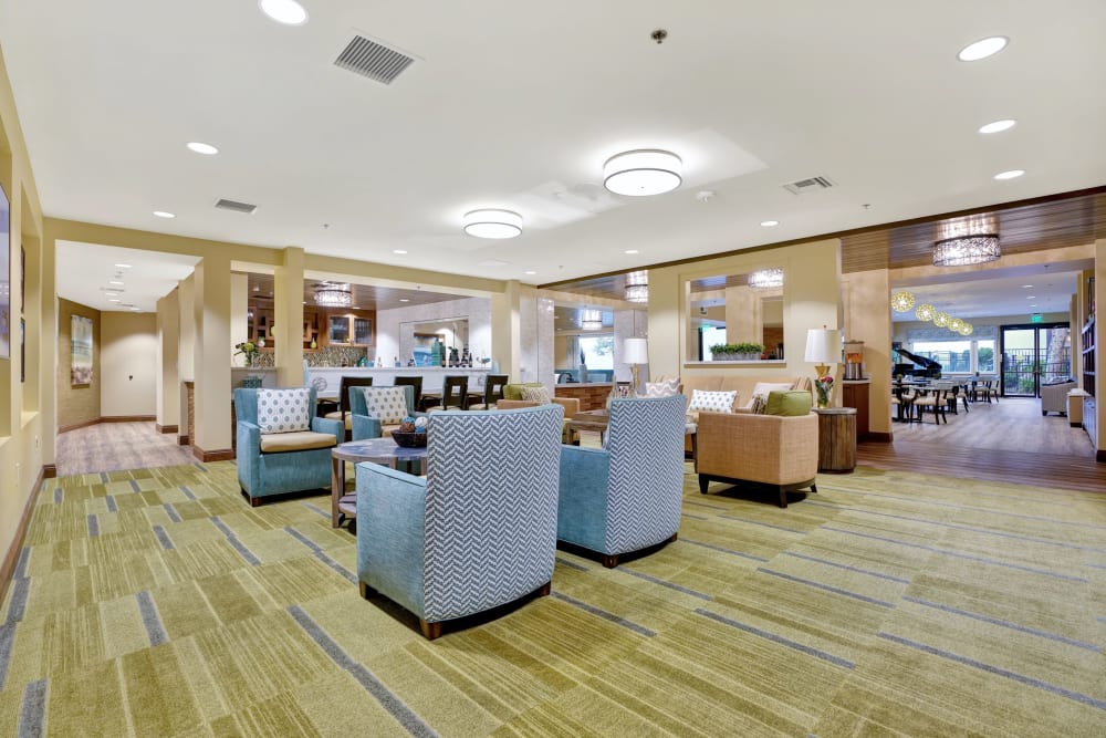 Lounge area near dining room with piano at The Montera in La Mesa, California