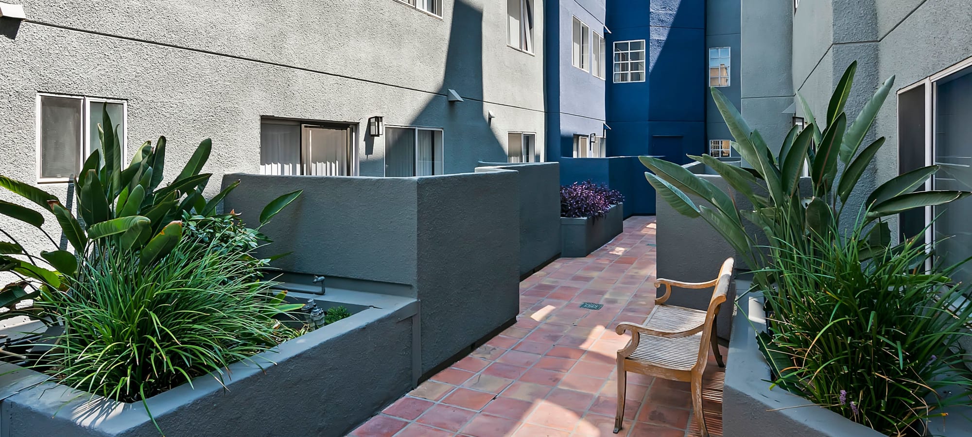 Beautifully landscaped courtyard at Kingsley Drive Apartments, Los Angeles, California