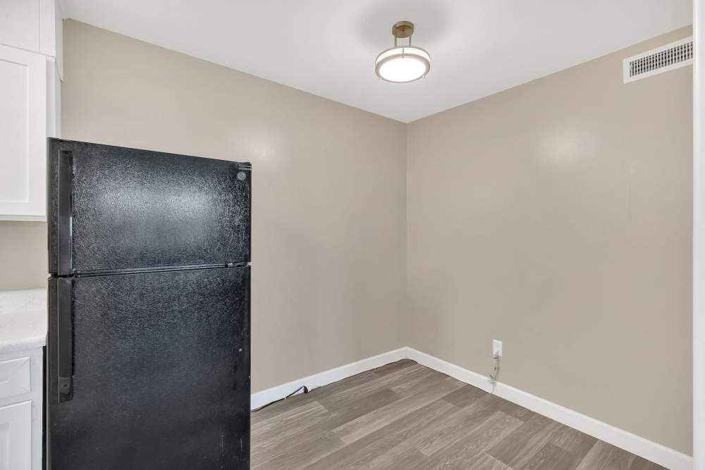 Lot of space for dining table with refrigerator at Bristol Square Apartments in Bristol, Tennessee