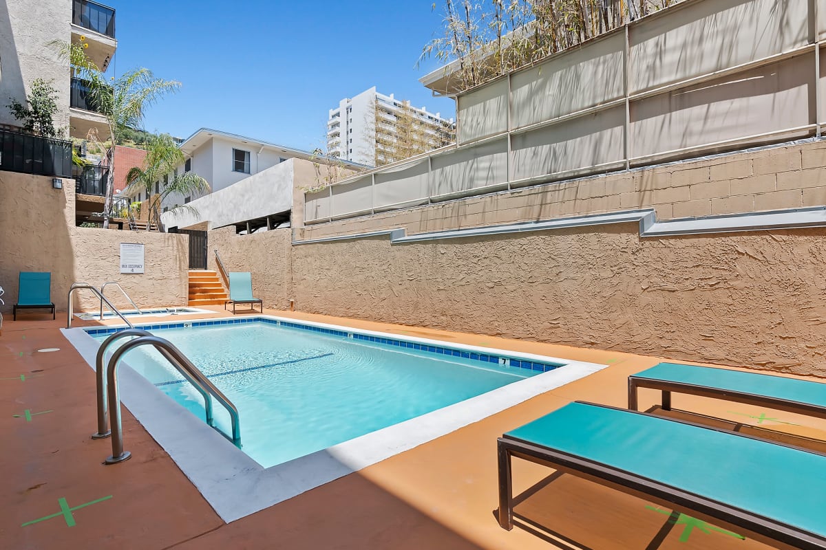 Pool with lounge chairs at Villa Careena, West Hollywood, California