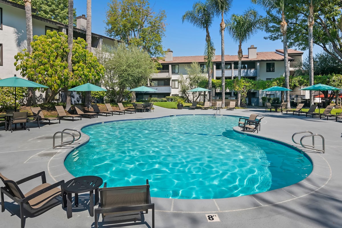 Pool with lounge chairs at Alura in Woodland Hills, California