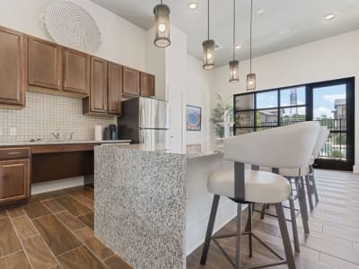 Stunning modern kitchen in with counter seating in the resident lounge at Auberge of Tyler in Tyler, Texas