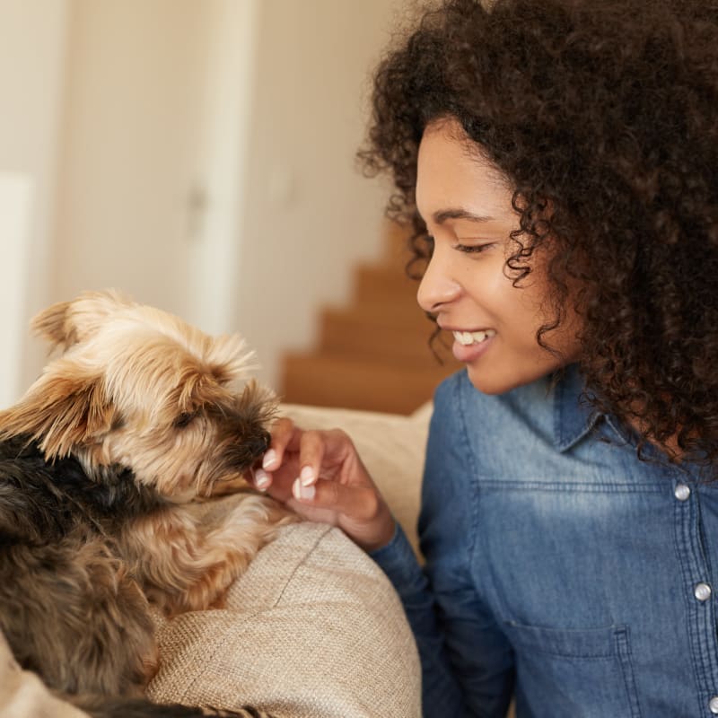 A resident sits with her puppy at The Encore, Alexandria, Virginia