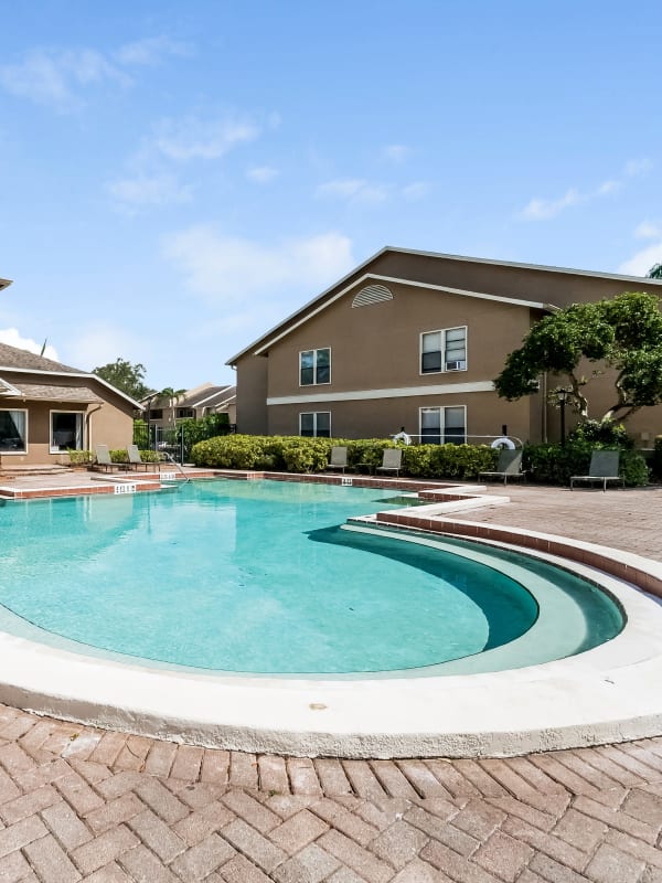 Resort-style swimming pool at Tuscany Pointe at Tampa Apartment Homes in Tampa, Florida