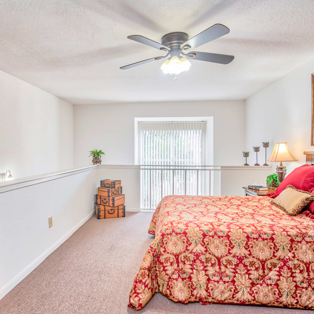 Modern-style bed and nightstand at South Oaks in Houston, Texas