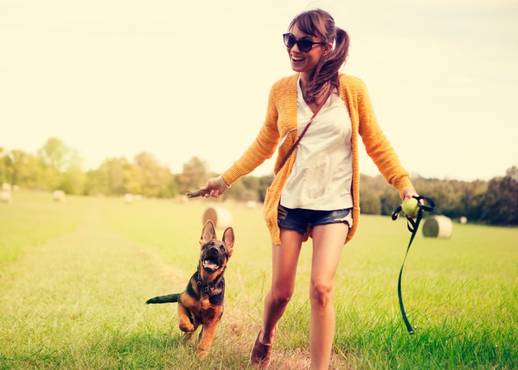 Woman with her dog chilling at Greenspoint at Paradise Valley