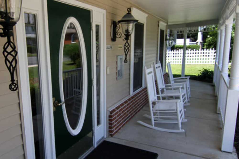Porch with chairs at Corner House in Havre De Grace, Maryland