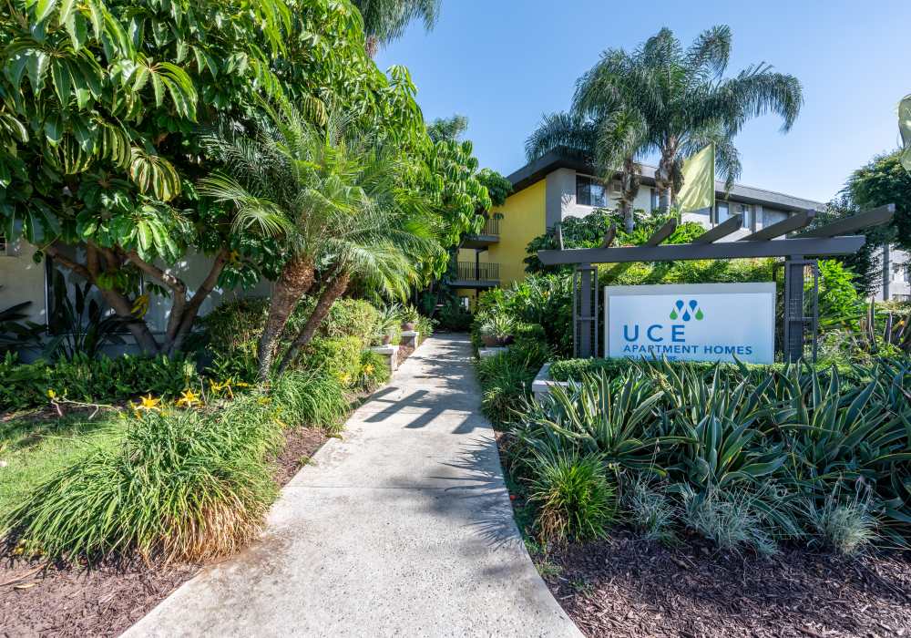 Sign board of the community at UCE Apartment Homes in Fullerton, California