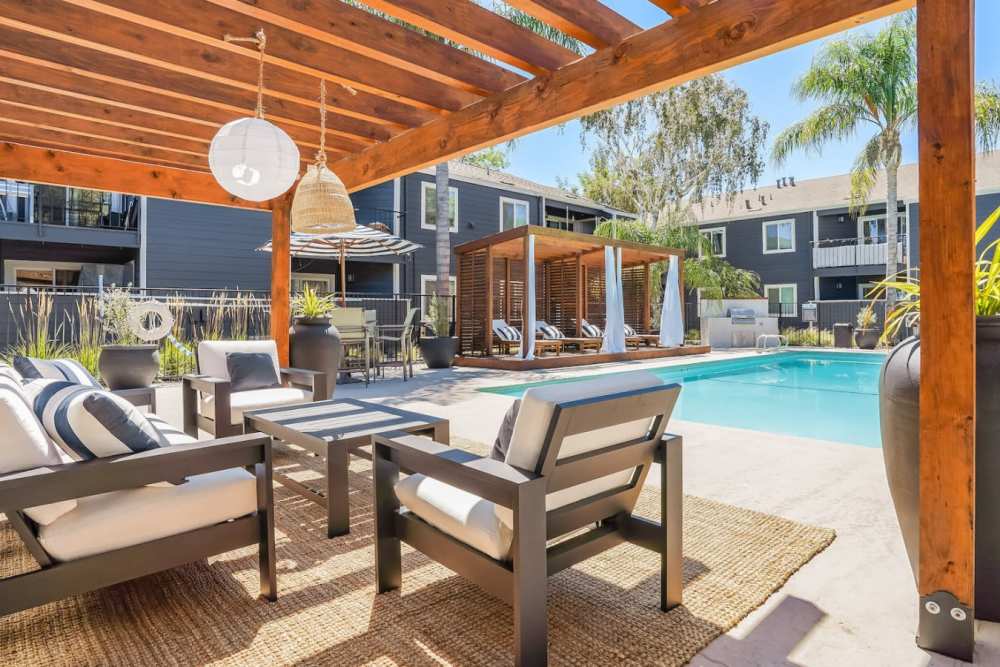 Sitting area next to pool at Trails at 2112 in Modesto, California.