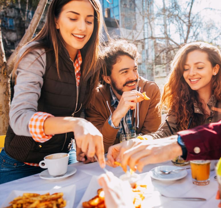 Friends gather for a picnic at a park near The Kendrick in Denver, Colorado