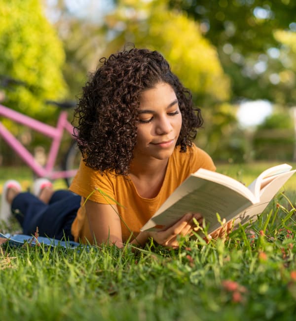 A woman reading in a park near Foundry Yards in Birmingham, Alabama