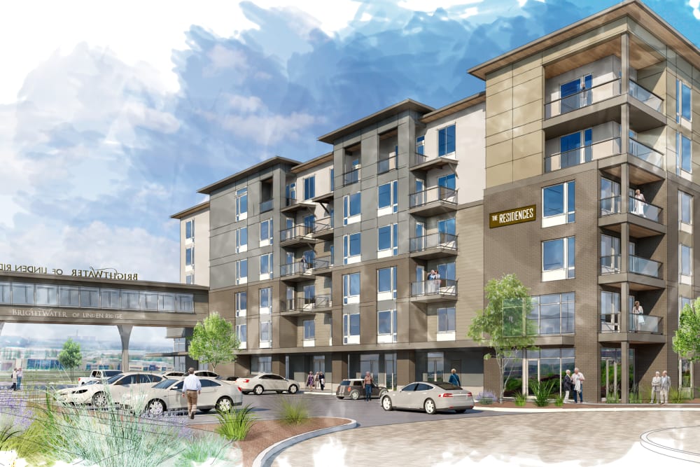 A rendering of the front entrance with cars parked in the front at Brightwater Senior Living of Linden Ridge in Winnipeg, Manitoba