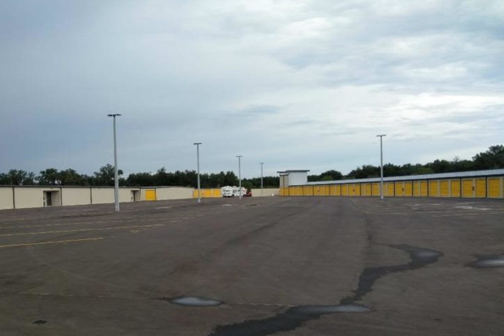 The parking lot and storage units with yellow doors at Stor 4 Dayz in Sanford, Florida