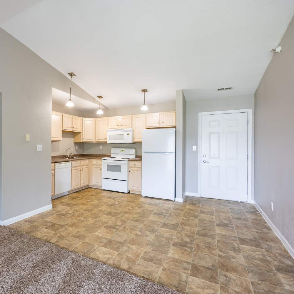 Modern kitchen with white appliances and vaulted ceiling at Southridge Commons in Lafayette, Indiana