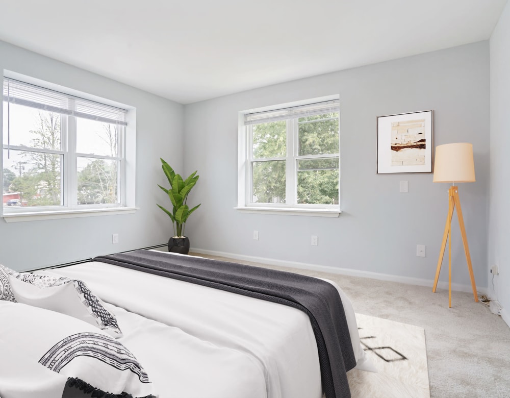 Bedroom with large windows at Bunt Commons I in Lindenhurst, New York