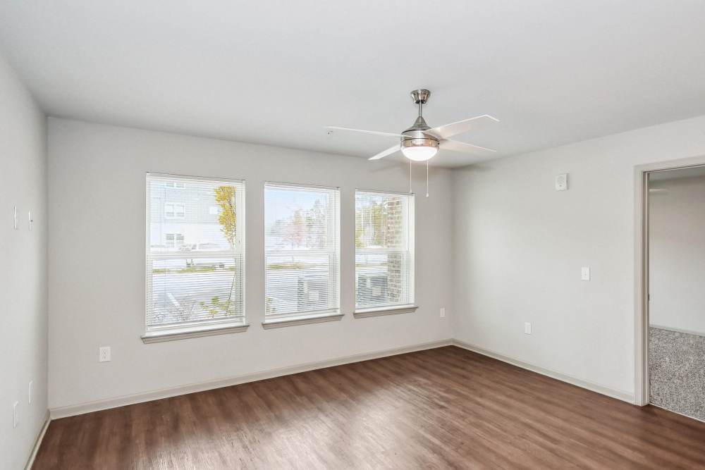 Living room with wooden flooring at Flats at Mount Zion in Stockbridge, Georgia