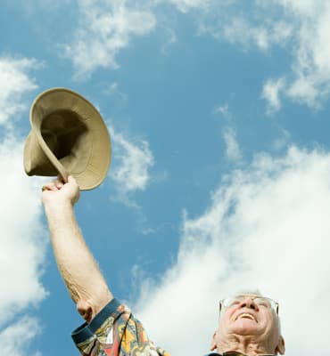 Resident raising his hat at Arbors Memory Care in Sparks, NV