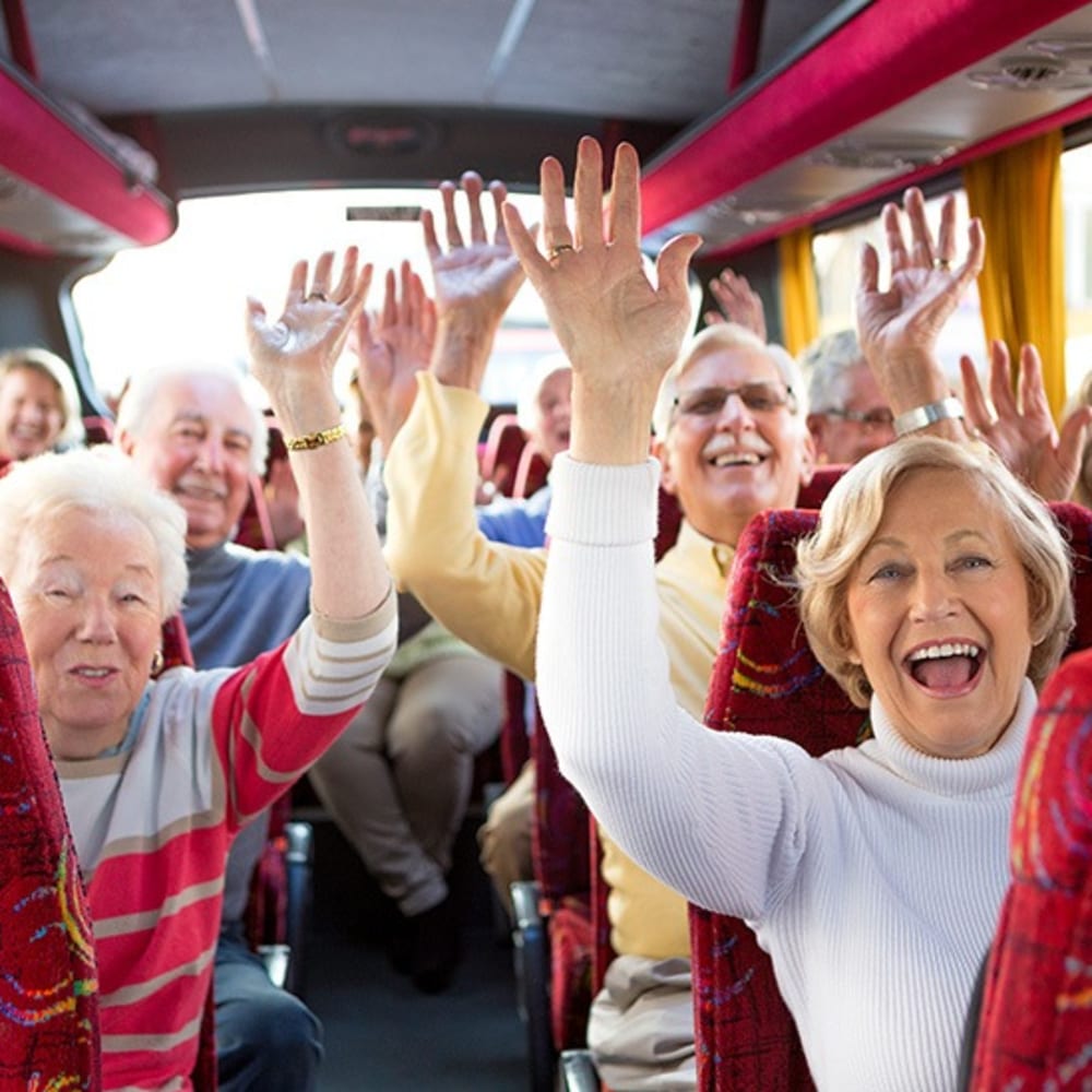 Happy residents on the bus at Fox Hollow Independent and Assisted Living in Bend, Oregon