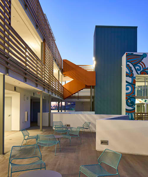 Courtyard with tables and chairs at Casa Querencia, Santa Ana, California