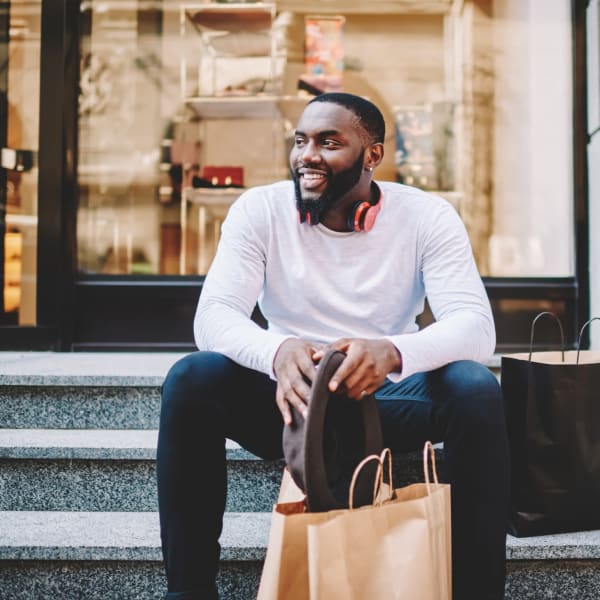 Resident sitting outside a boutique near Note 16 in Nashville, Tennessee