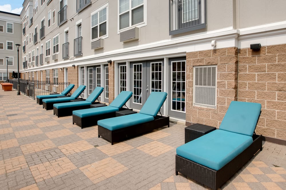 A sundeck with comfortable lounge chairs at Loring Park Apartments in Minneapolis, Minnesota