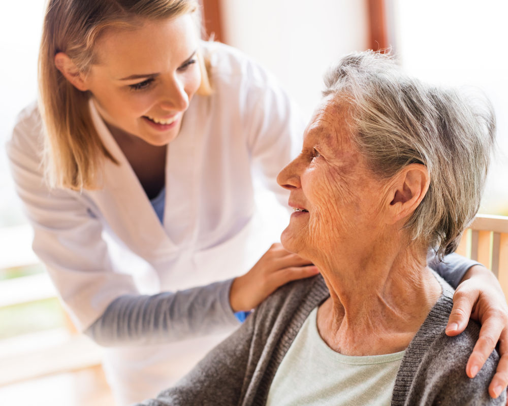 Nurse helping senior at Seven Lakes Memory Care in Loveland, Colorado
