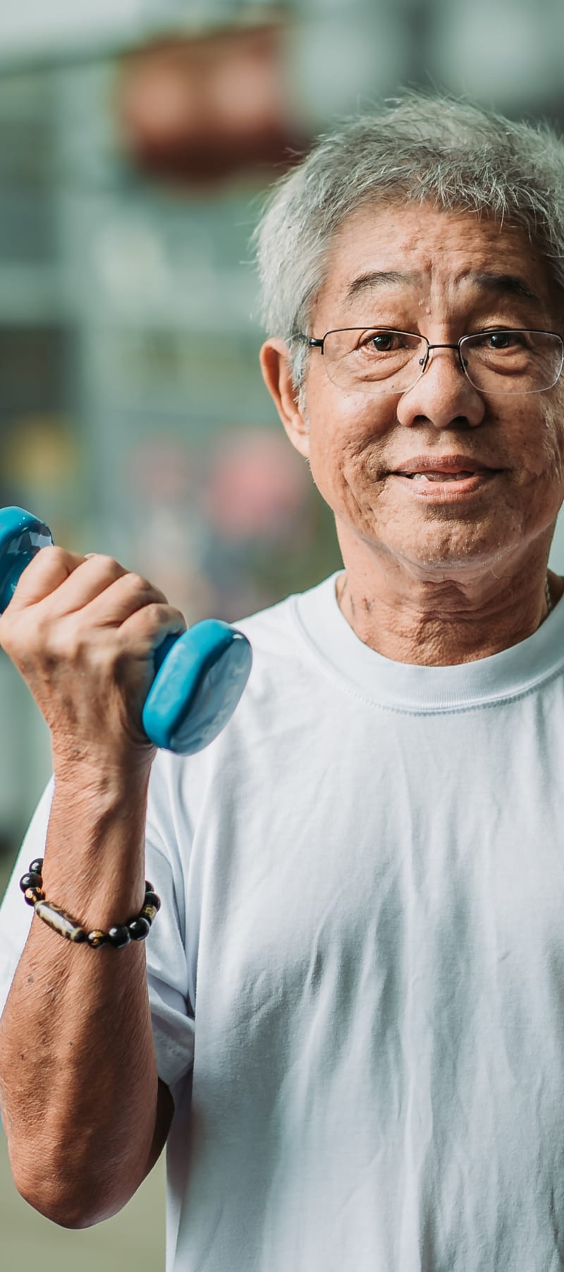 Resident working with a physical therapist and dumbbells at Holton Manor in Elkhorn, Wisconsin