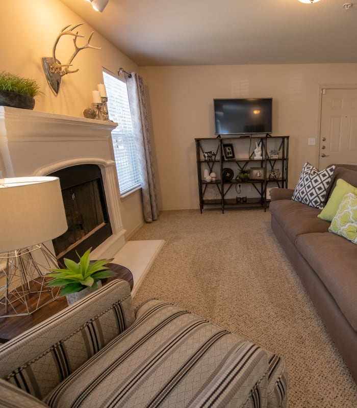 Carpeted living room at Remington Apartments in Amarillo, Texas