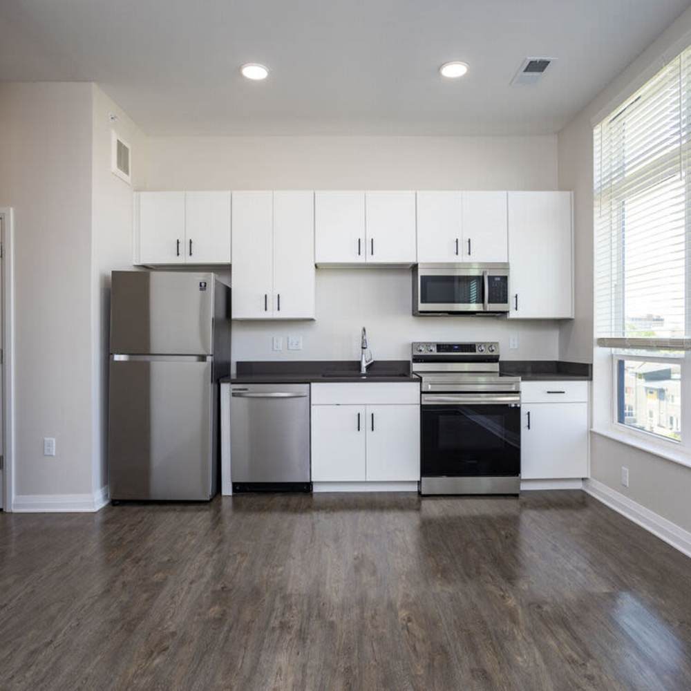 Open kitchen with wood flooring at The Sutton in , Ohio