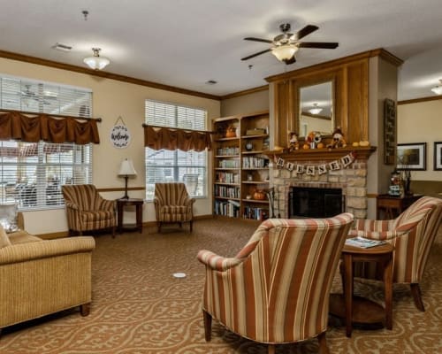 Spacious community area with fireplace at Trustwell Living at Urbana Place in Urbana, Ohio