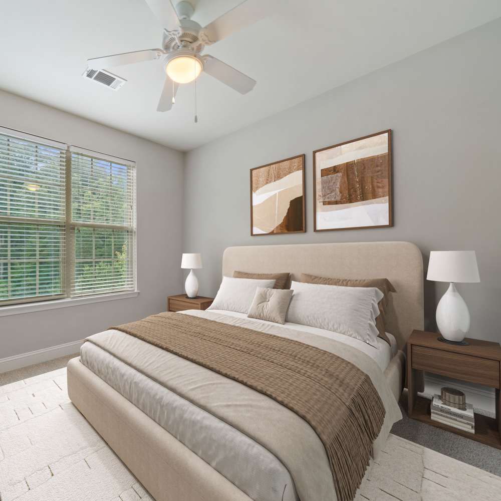 Cozy bedroom in a model home at Retreat at Hunt Hill in Asheville, North Carolina
