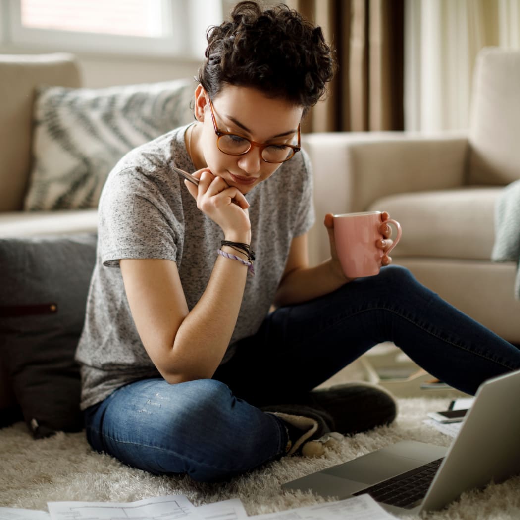 Resident working in her living room at Fenton Silver Spring in Silver Spring, Maryland.