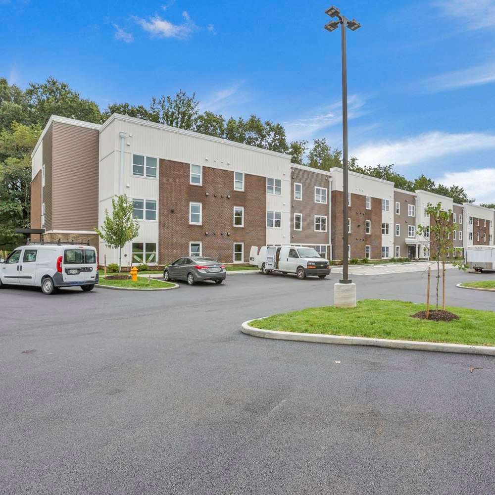 Apartment building with parking area at The Lofts On First in The Plains, Ohio